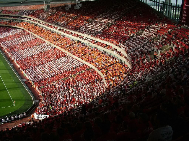 Large stadium filled people sidelines free wallpaper - medium preview image