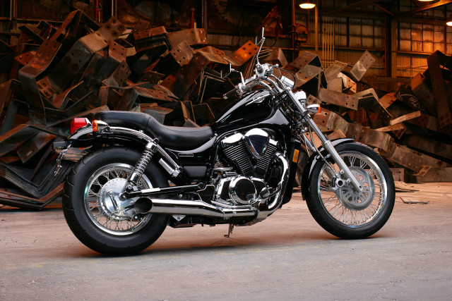 Motorcycle parked warehouse wood planks free wallpaper - medium preview image