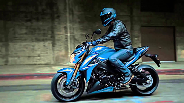 Man riding blue motorcycle graffiti free wallpaper - medium preview image