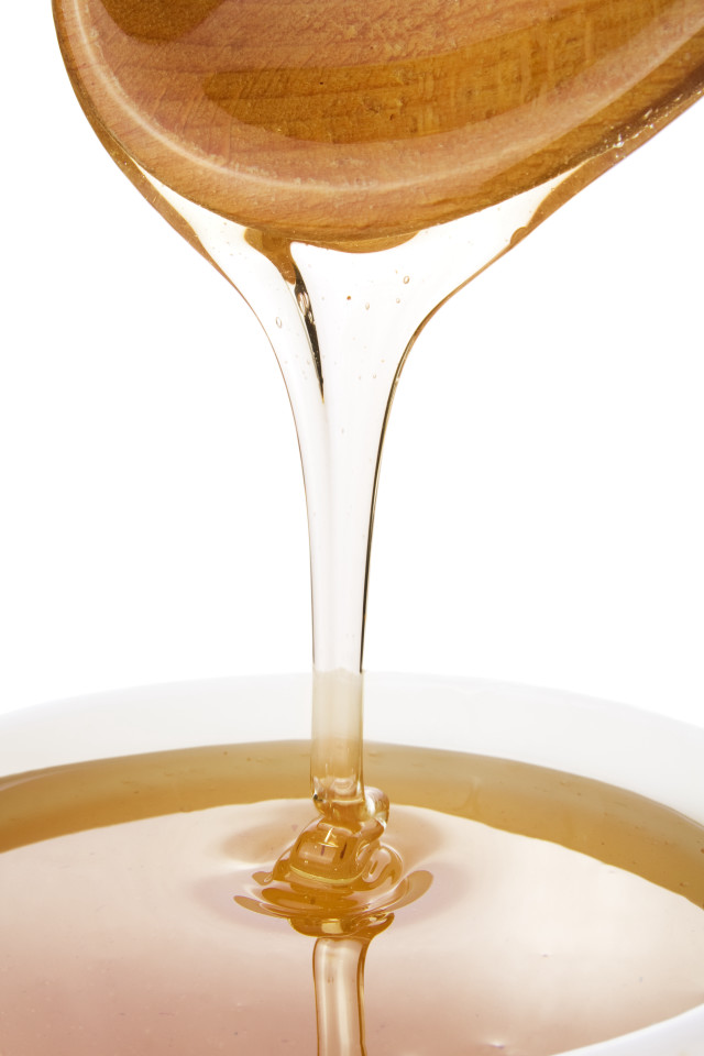Wooden spoon pouring liquid bowl free wallpaper - medium preview image