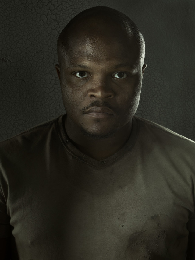 Man brown shirt serious look free wallpaper - medium preview image