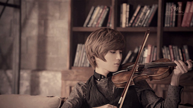 Young man violin library bookshelves free wallpaper - medium preview image