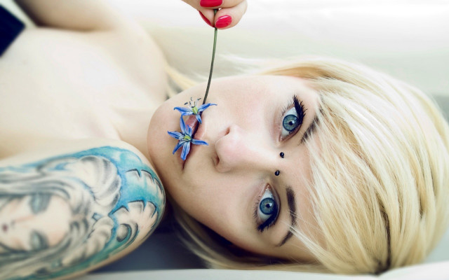 Woman flower nose tattoo arm free wallpaper for desktop - medium preview image