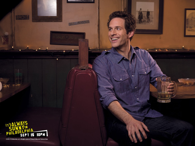 Man sitting booth drink suitcase free wallpaper - medium preview image