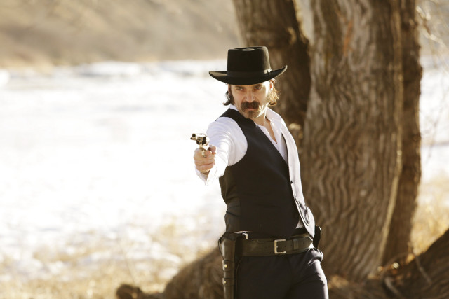 Man hat vest gun pointing free wallpaper for desktop - medium preview image