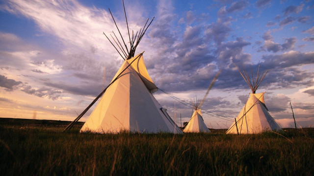 Teepees field cloudy sky grass free wallpaper - medium preview image