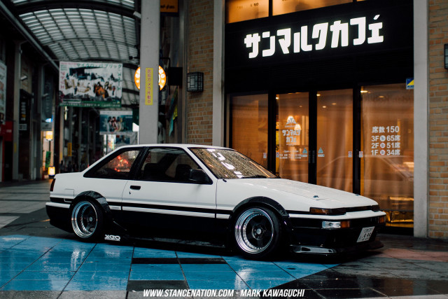 White car parked building city free wallpaper - medium preview image