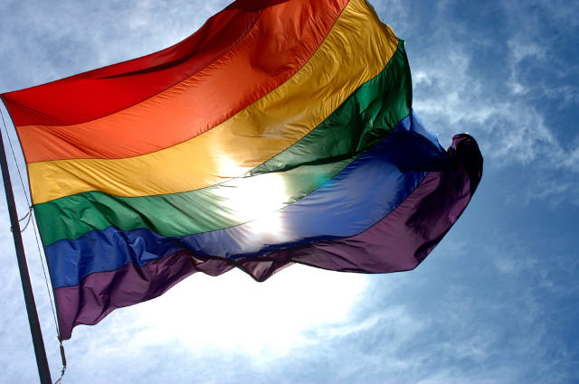 Rainbow flag flying wind blue free wallpaper - medium preview image