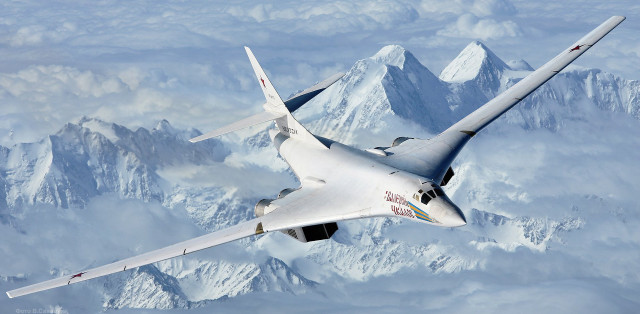 Jet flying mountain range sky free wallpaper - medium preview image