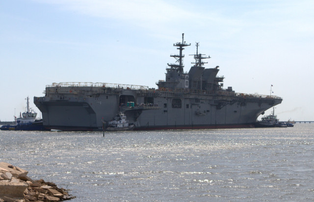 Large ship docked water rock free wallpaper - medium preview image