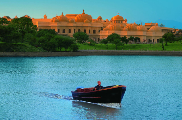 Man boat lake large building free wallpaper - medium preview image