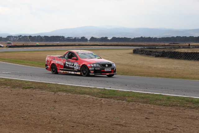 Red car race track mountains free wallpaper - medium preview image