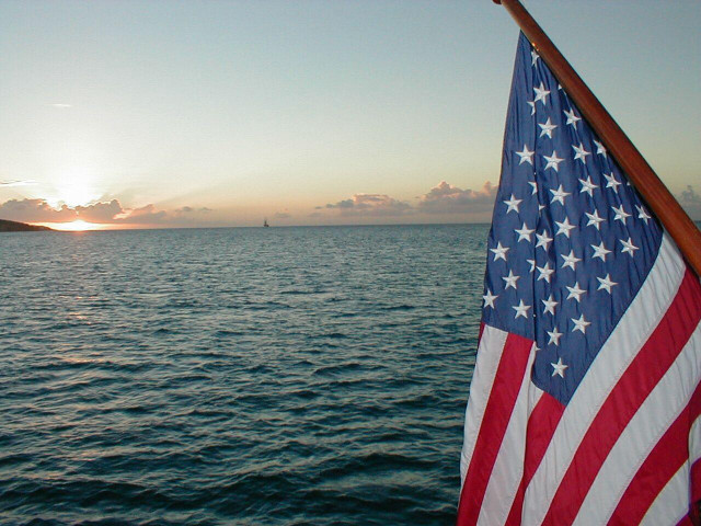 Flag boat water sunset distant free wallpaper - medium preview image