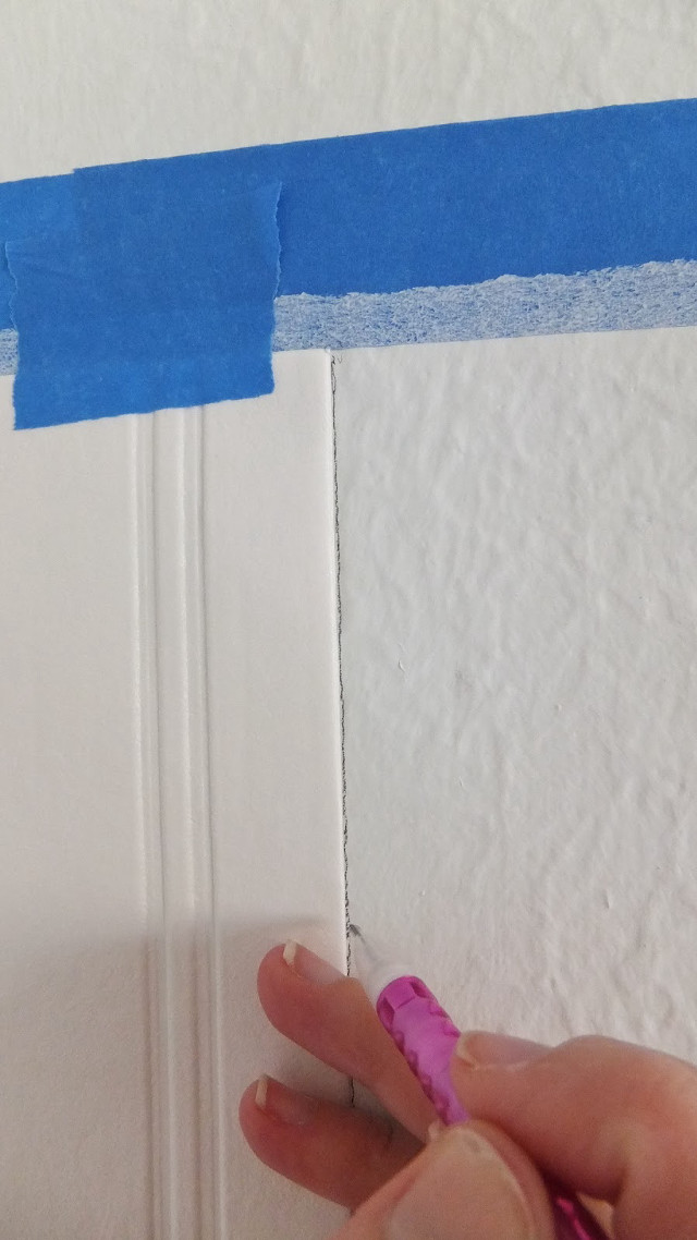 Person holding blue tape wall free wallpaper - medium preview image