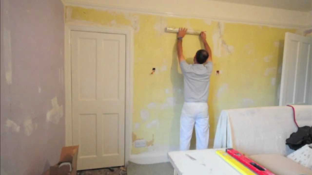 Man painting yellow room white free wallpaper - medium preview image