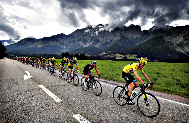 Cyclists riding road mountain range free wallpaper - medium preview image