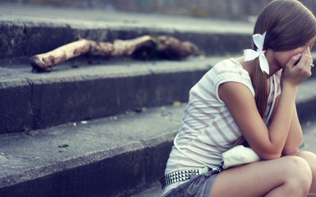 Girl sitting steps crying cellphone free wallpaper - medium preview image