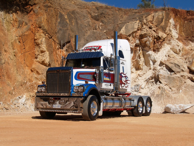 Semi truck rocky cliff mountain free wallpaper - medium preview image