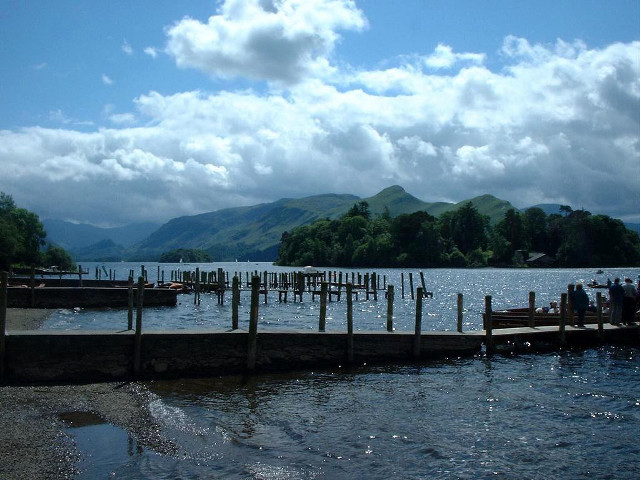 Docked people mountains clouds lake free wallpaper - medium preview image