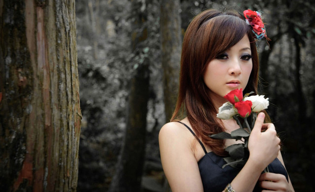 Woman holding flower forest trees free wallpaper - medium preview image