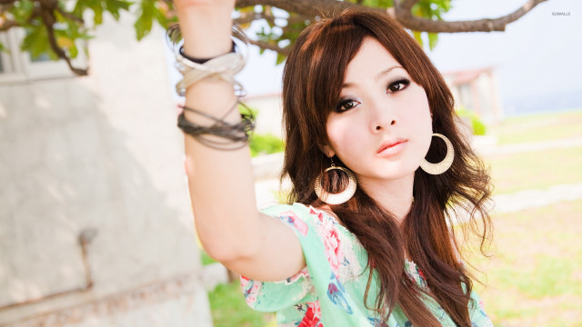 Woman hoop earrings green shirt free wallpaper - medium preview image
