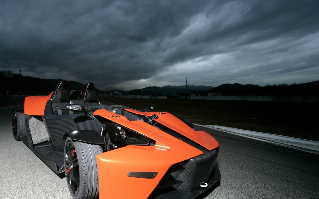 Orange car stormy sky matte free wallpaper - medium preview image
