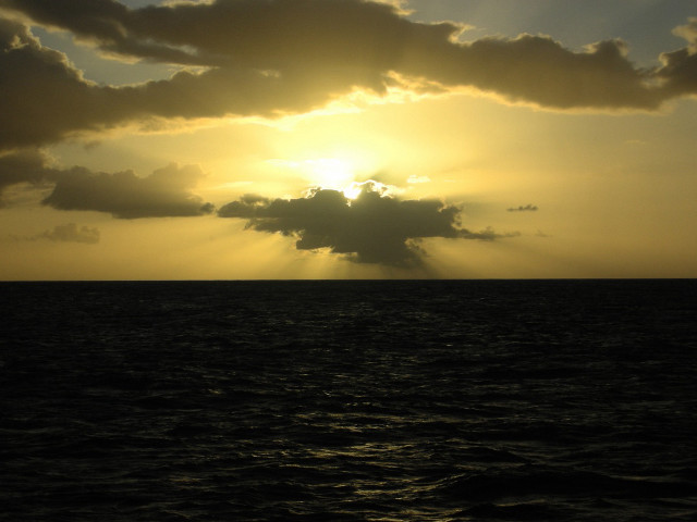 Sunshine clouds ocean boat water free wallpaper - medium preview image