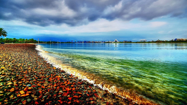 Beach water cloudy sky city free wallpaper - medium preview image