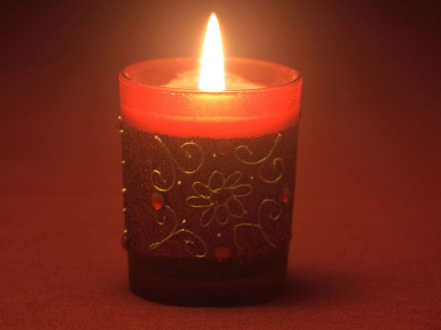 Lit candle red background white #2 free wallpaper - medium preview image