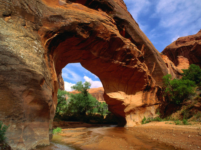 Large rock formation stream cloudy free wallpaper - medium preview image