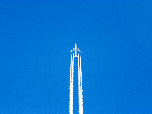 Jet flying blue sky contrails free wallpaper - medium preview image