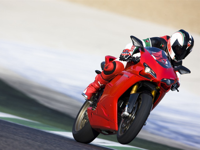 Person riding red motorcycle track free wallpaper - medium preview image
