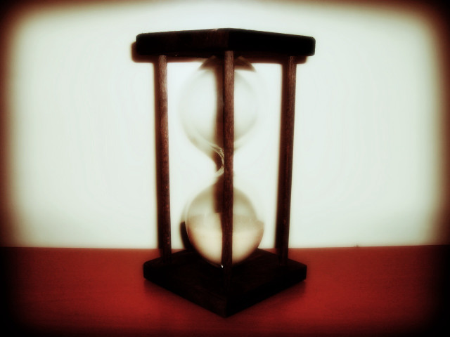 Hourglass person face red table free wallpaper - medium preview image