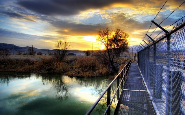 Fence water sunset chainlink serene free wallpaper - medium preview image