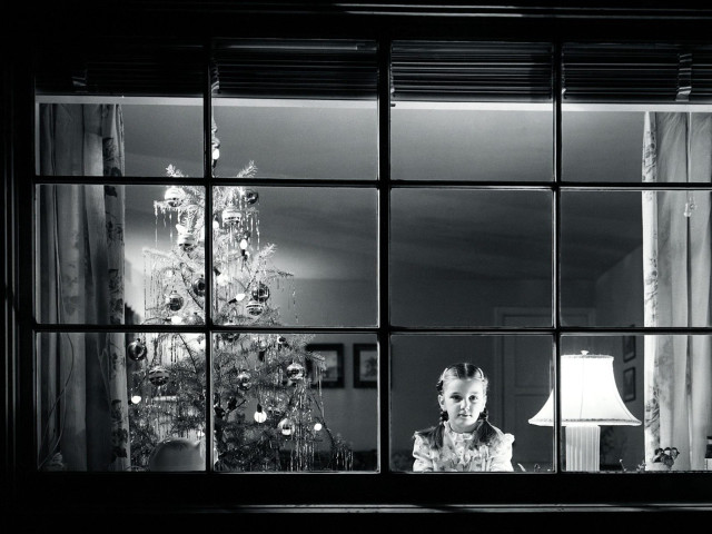 Woman looking out window christmas free wallpaper - medium preview image