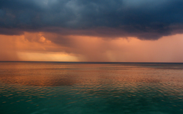 Storm cloud ocean boat sunset free wallpaper - medium preview image