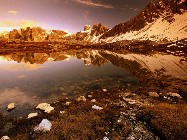 Mountain range lake rocks grass free wallpaper - medium preview image