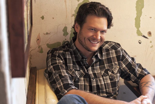 Man bench smiling camera plaid free wallpaper - medium preview image