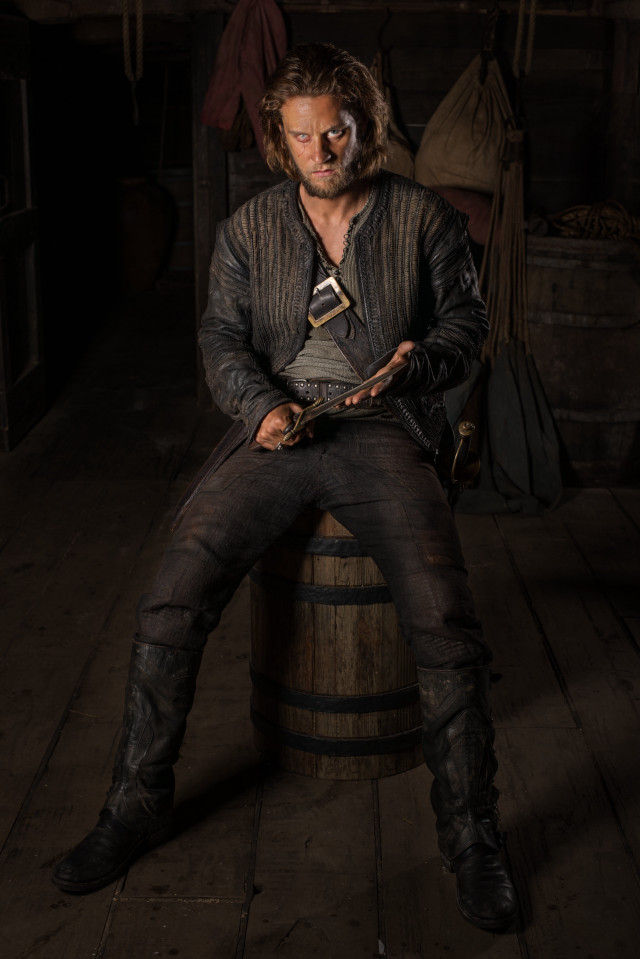 Man sitting barrel wooden floor free wallpaper - medium preview image