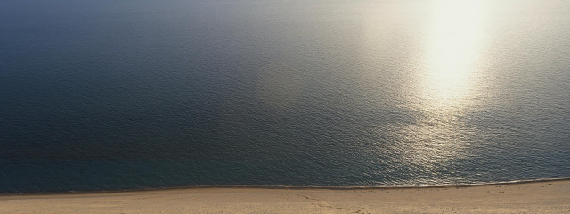 Beach water boat distance sun free wallpaper - medium preview image