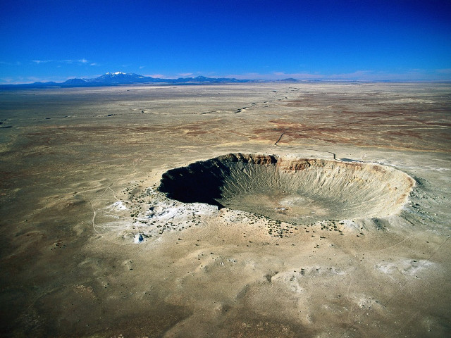 Large crater desert plain mountains free wallpaper - medium preview image