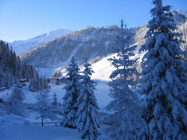Snowy mountain trees house background free wallpaper - medium preview image