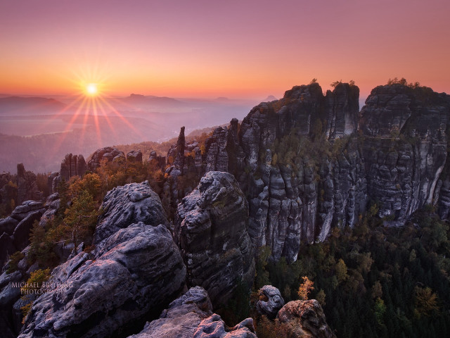 Sunset mountains trees rocks cityscape free wallpaper - medium preview image