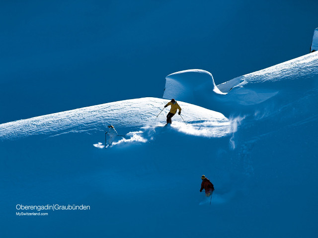Skiing couple snow covered slope free wallpaper - medium preview image