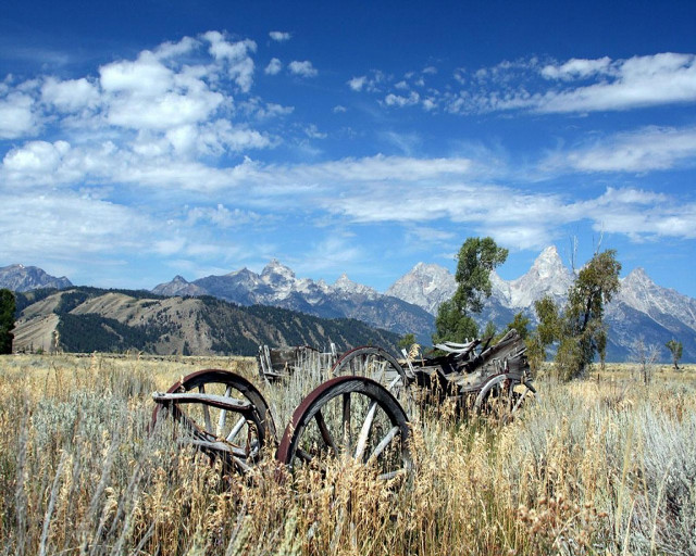 Field old wooden wheels mountains free wallpaper - medium preview image