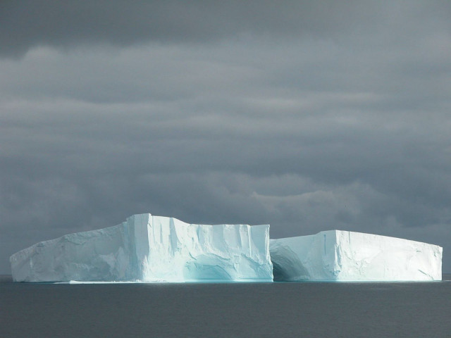 Iceberg ocean cloudy sky boat free wallpaper - medium preview image