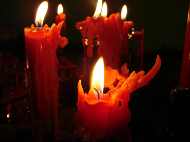 Lit candles on table dark free wallpaper - medium preview image