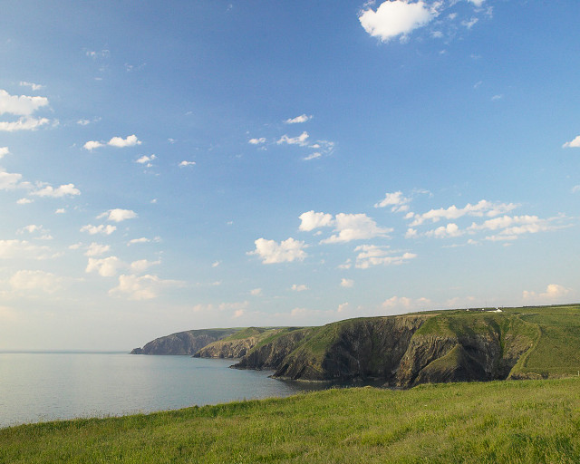 Grassy field water cliff sky #2 free wallpaper - medium preview image