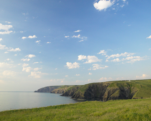 Grassy field water cliff sky #3 free wallpaper - medium preview image