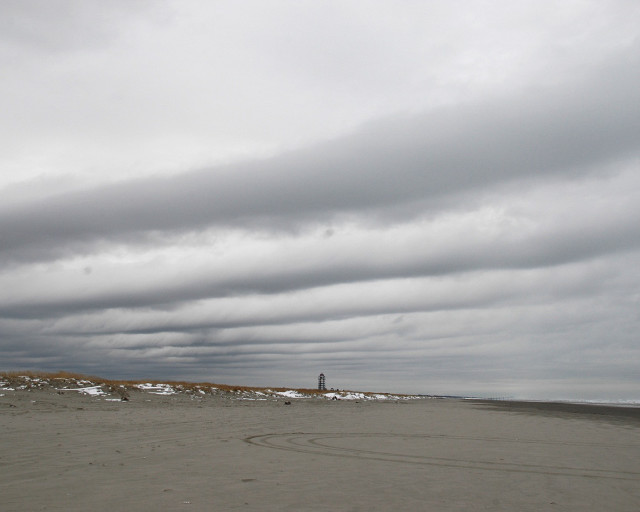 Kite beach cloudy lighthouse person #2 free wallpaper - medium preview image